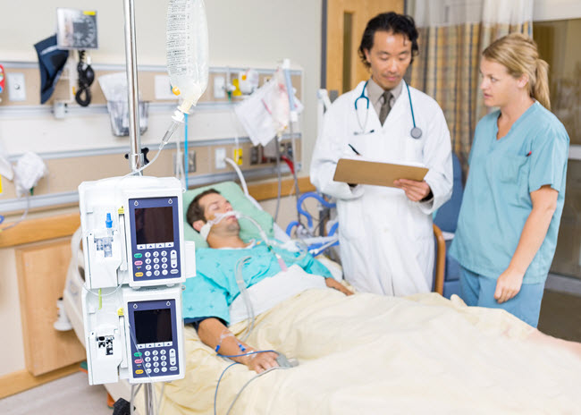 Patient in Hospital with Nurse and Doctor.