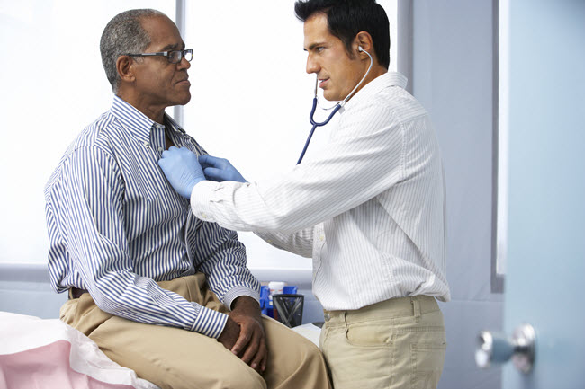 Doctor Listening to a Patients Heart.