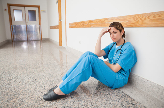 Nurse Sitting on the Floor.